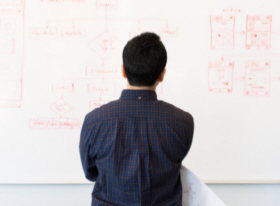 Man looking at a whiteboard